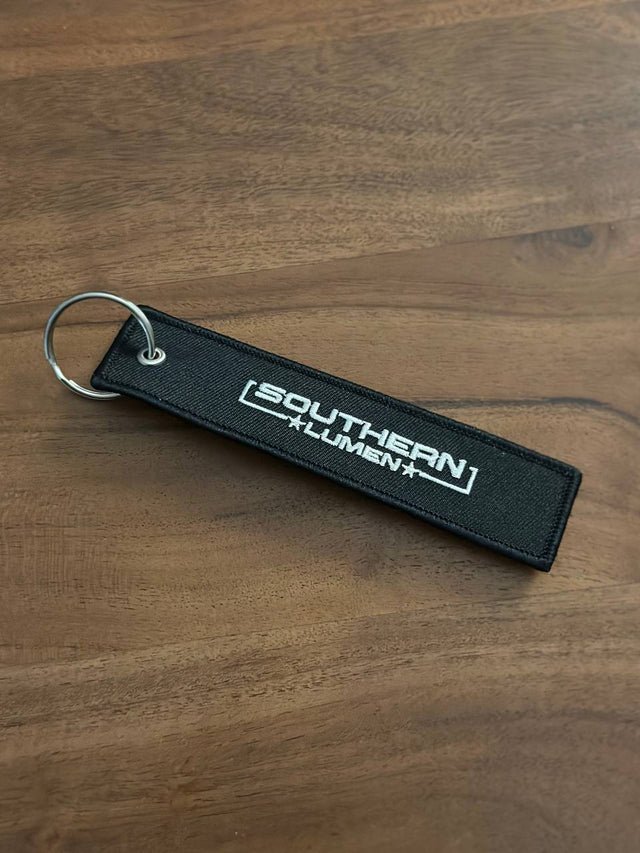 Southern Lumen keytag, featuring the Southern Lumen logo, perfect for keys or accessories.