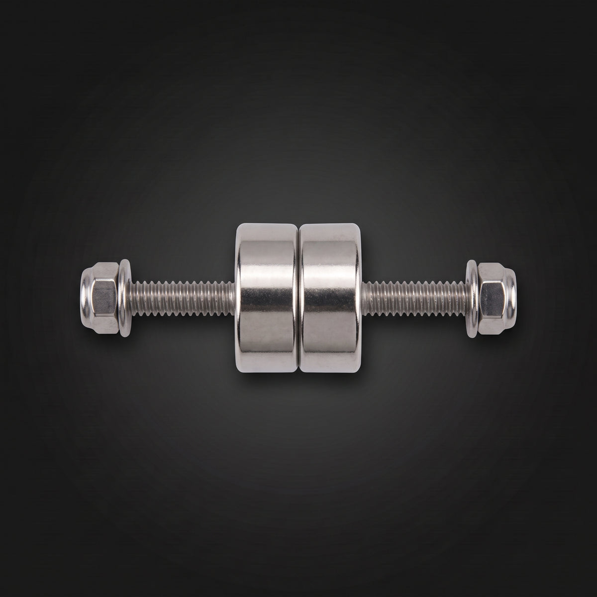Rock light magnetic mounts, two round magnets on a threaded screw with lock nuts and washers on a dark studio background
