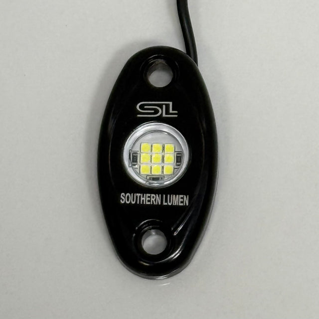 Southern Lumen 9-LED pure white rock light with a durable construction and bright illumination, ideal for enhancing vehicle aesthetics and off-road visibility.